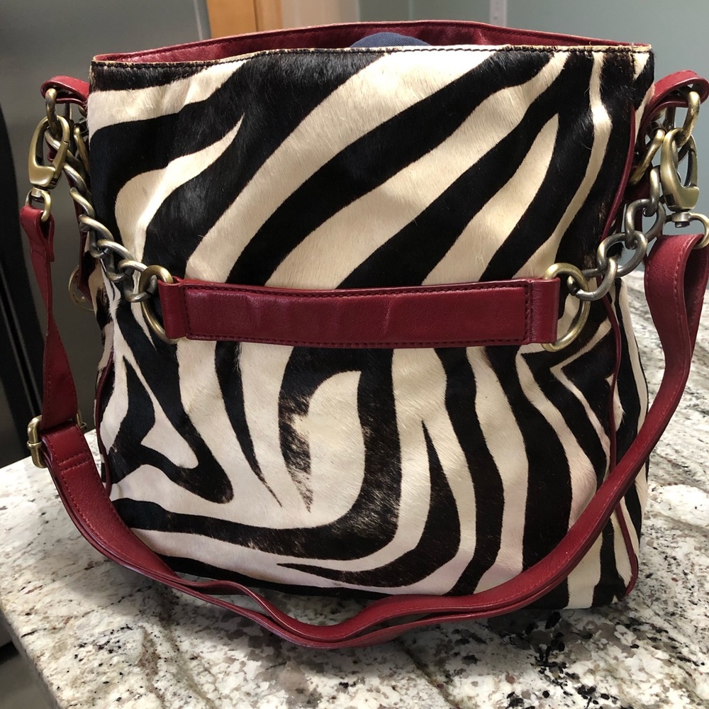 Johnston & Murphy distressed animal print purse